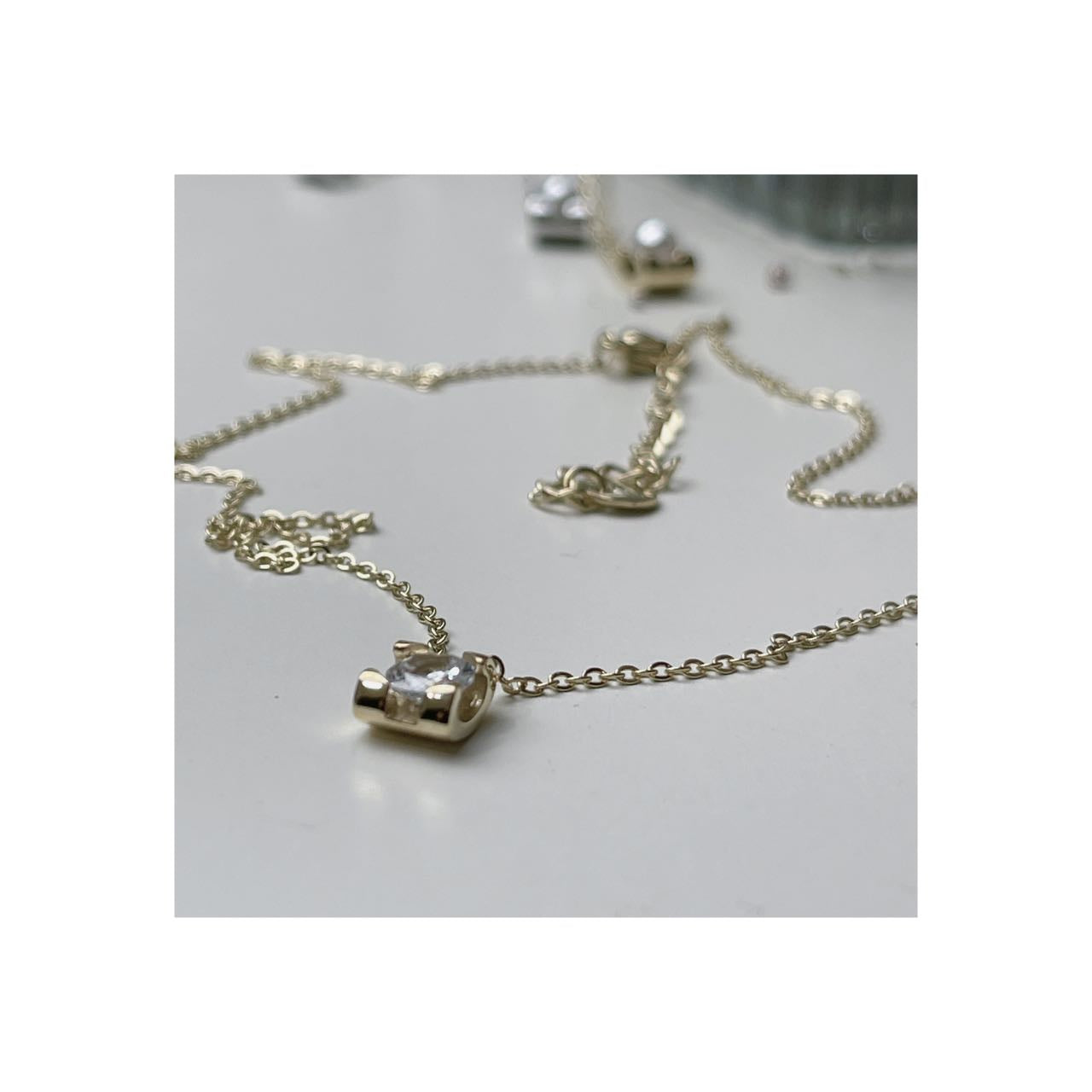 collana punto luce quadrato